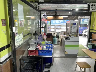 a view of a shop with a glass door at Ali Hostel in Bangkok