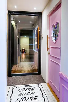a pink door with a heart painted on it at The Spades Private Residence in Bangkok