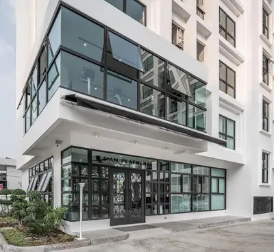 an office building with a large glass facade at Siamplaengna Residence in Bangkok