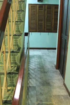 an empty hallway with a glass floor and a door at Swan inn 2 Nana in Bangkok