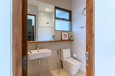 a bathroom with a sink and a toilet and a mirror at APT476 in Bangkok