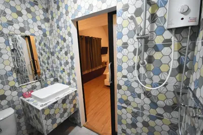 a bathroom with a sink and a mirror at Tiny hut resort in Bangkok