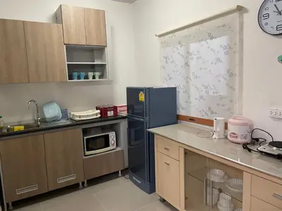 a kitchen with a blue refrigerator and a microwave at M Villa @ Impact Muangthongthani in Ban Bang Phang