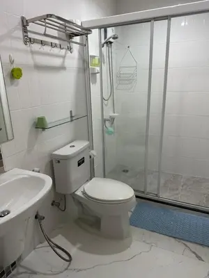 a bathroom with a shower and a toilet and a sink at M Villa @ Impact Muangthongthani in Ban Bang Phang
