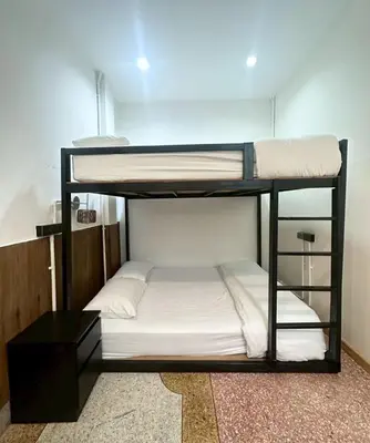 a couple of bunk beds in a room at Taladnoi Paint House in Bangkok