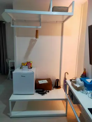 a room with a bunk bed and a desk at Bed By Boat @Nonthaburi Pier in Nonthaburi