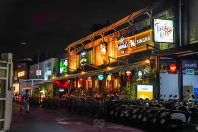 a city street at night with a bunch of buildings at Maitria Hotel Rama 9 Bangkok - A Chatrium Collection in Bangkok