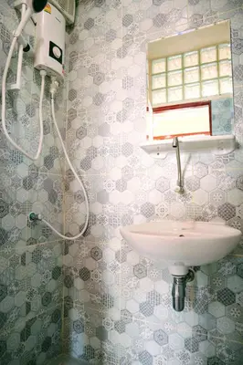 a bathroom with a sink and a shower at Sky bedroom with a smooth life view in Bangkok