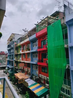a tall building with colorful balconies on it at Cloud no 4 Green n Quiet Heart BKK With a Balcony in Bangkok