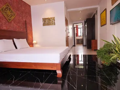 a bedroom with a bed in a room at Old Sрice 5 Elegant Tranquility Your BKK Haven in Bangkok