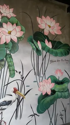 a painting of flowers and a bird on a wall at baankorrakang in Bangkok Noi