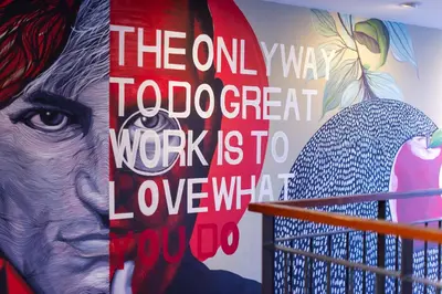a mural of a woman and a microphone on a wall at BB Glass House บีบี กลาสเฮ้าส์ in Bangkok