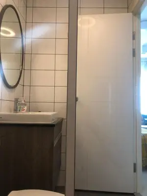 a bathroom with a shower and a sink at Chapter One Eco-Modern Suite (\u66fc\u8c37\u9ad8\u7aef\u9152\u5e97\u516c\u5bd3\uff09 in Bangkok
