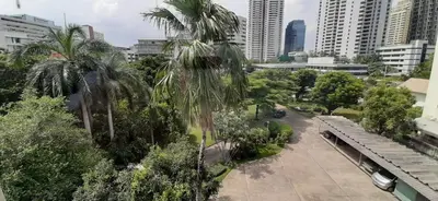 a view of a city with palm trees and buildings at City Plaza Nana Hotel in Bangkok