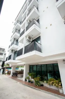 a white building with plants in front of it at ATC Residence in Bang Su