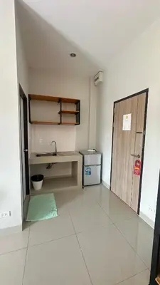 an empty room with a sink and a door at Buathong Pool Villa in Ban Khung Taphao