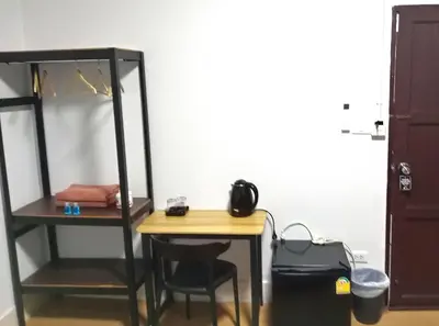 a room with a desk and a bunk bed at U&D guest house in Bangkok