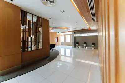 an office lobby with a hallway with a waiting room at Royal Delight Hotel in Bangkok