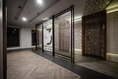 a hallway with a door and a wall with writing on it at VIX Bangkok at Victory Monument in Bangkok