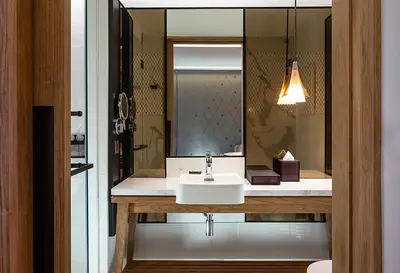 a bathroom with a sink and a mirror at Homm Sukhumvit34 Bangkok in Bangkok