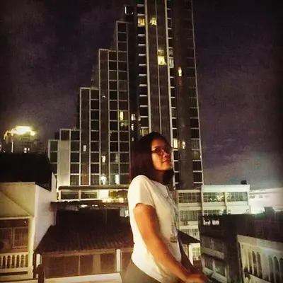 a man standing on top of a tall building at Station8 Hostel in Bangkok