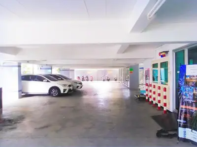 a parking garage with a car parked in it at THE PRIZE in Ban Yang