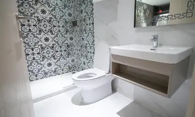a bathroom with a white toilet and a sink at Pannarai Hotel Bangkok-Pra tunam in Bangkok