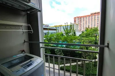 a balcony with a view of a building at Nice Condo near Ramkhamhaeng 60, Lam Sali MRT in Bangkok