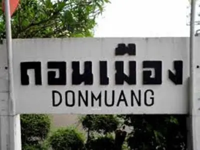 a sign for a dominating at Asia Don Mueang Bangkok Condominium in Thung Si Kan