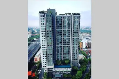 an aerial view of a tall white building at The Base Park East - Bangkok Sukhumvit 77 in Bangkok