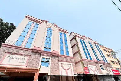 a building on the corner of a street at Big Bird Palace Ladprao 71 in Bangkok