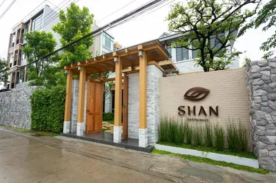 a building with awning on the side of a building at SHAN Villas Sukhumvit ฌานวิลล่า สุขุมวิท in Bangkok