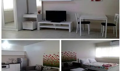 two pictures of a living room and a kitchen at Chan Kim Don Mueang Guest House, located in Pak Kret in Thung Si Kan