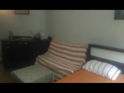 a room with a bed and a bench and a desk at Popular Palace in Don Mueang Bangkok in Ban Bang Phang