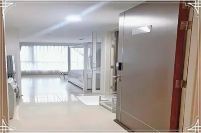 a room with a door leading to a living room at Nice Residence in heart of Bangkok in Bangkok