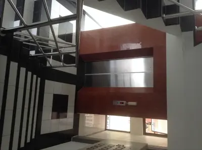 a stairwell in a building with a window at Baan Romdee in Nonthaburi