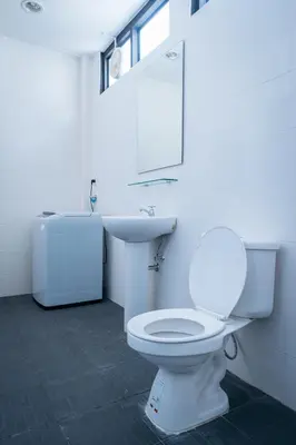 a bathroom with a white toilet and a sink at T3 TWO Bedrooms WIFI Full kitchen 1 min to BTS in Bangkok
