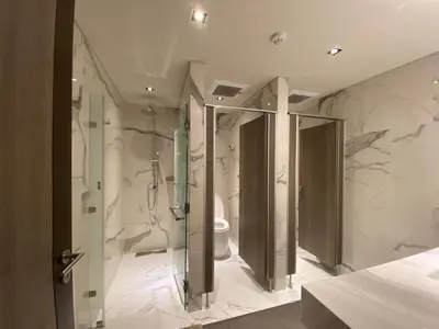 a bathroom with a shower and a toilet at Politan Breeze, Chaophraya River view in Ban Sai Ma