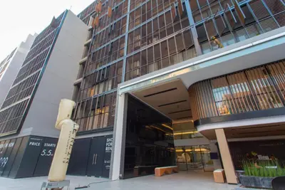 a large building with a large entrance to it at Bangkok Asok Circle REIN Sukhumvit 12#2BR&3BR#Pool&Gym#Near Terminal 21 in Bangkok