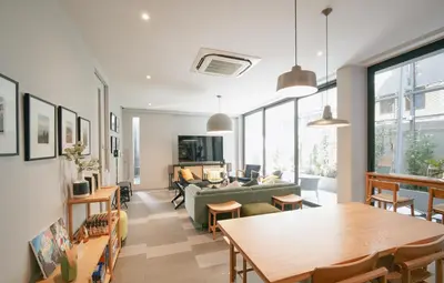 a living room with a couch and a table at humble abode Bangkok Vacation Home in Bangkok