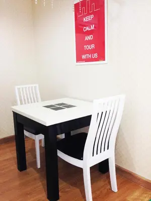 a black and white table and two white chairs at iCheck inn Residences Sathorn in Bangkok