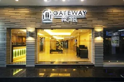 a coffee shop with a sign on the front of it at Gateway Hotel Pratunam in Bangkok