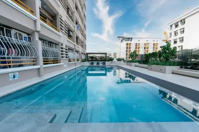 a swimming pool in the middle of a building at L.A. Tower Hotel in Bangkok