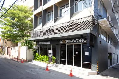 a building with a sign that reads los singrowing at 185@Surawong Residence in Bangkok
