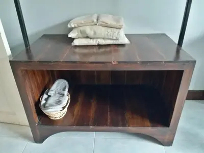 a table with two towels and a pair of shoes on it at Platinum Place in Bangkok