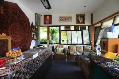 a living room with a couch and a counter top at Platinum Place in Bangkok