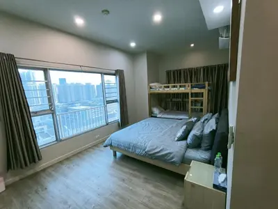 a bedroom with a bed and a large window at \u6eab\u99a8\u5c0f\u5c4b in Bangkok