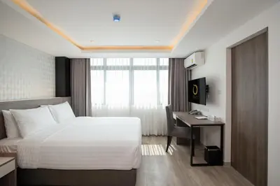 a hotel room with a bed and a desk at ORION Hotel & Residence Bangna in Bangkok