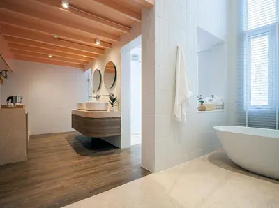 a bathroom with a tub and a sink at Bonsai Hotel Bangkok in Bangkok