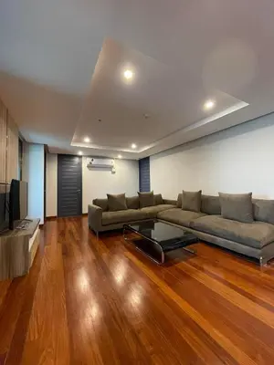 a living room with a couch and a coffee table at ViVi Avenue Thonglor in Bangkok